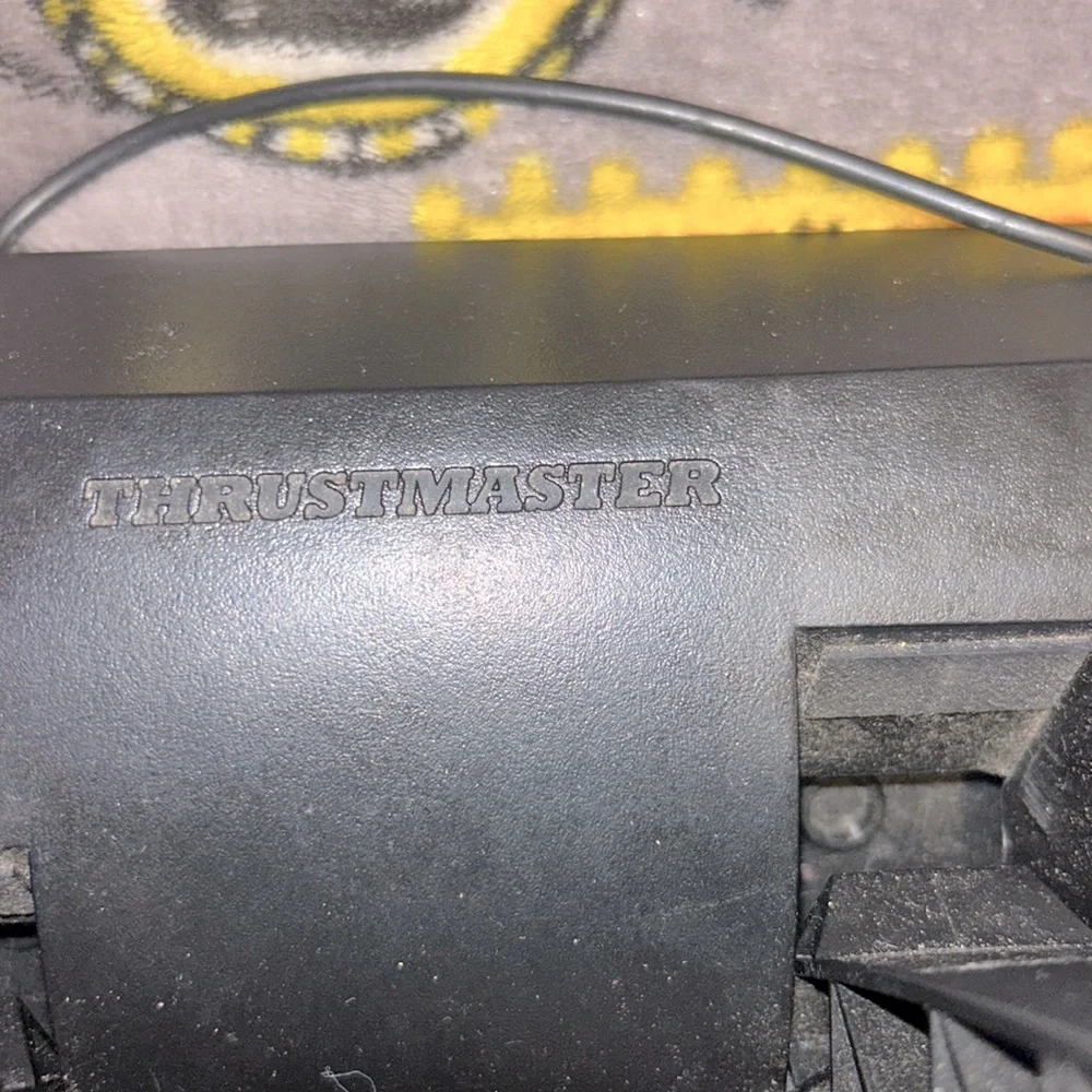 Thrustmaster t80 racing wheel set for PlayStations and can work on pc with code